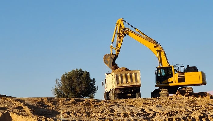 excavator-machine-filling-truck-in-construction-si-2022-04-19-16-26-24-utc-jpg
